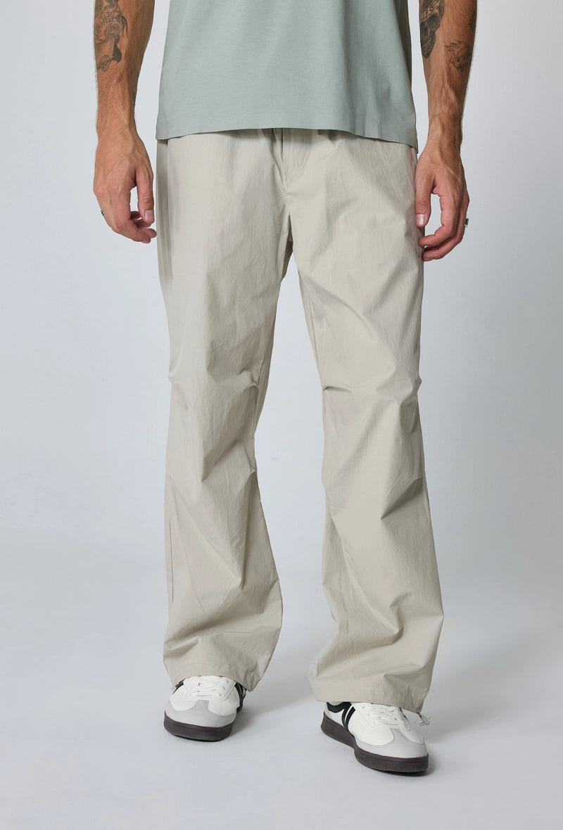 Parachute pants adjustable at the waist and ankles