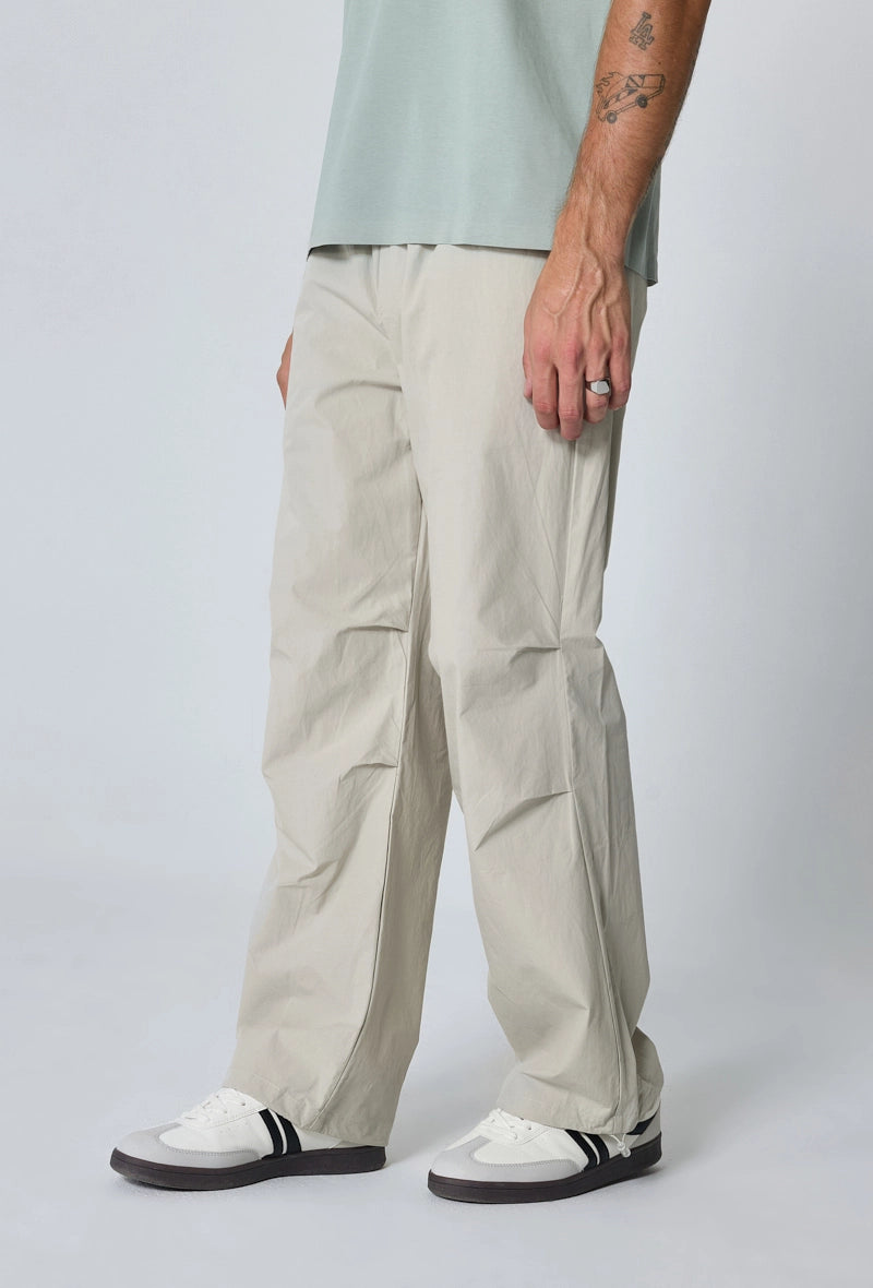 Parachute pants adjustable at the waist and ankles