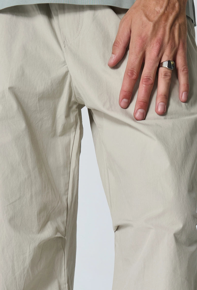 Parachute pants adjustable at the waist and ankles